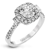 This white gold ring glitters with accents of .41 ctw of round white diamonds and .14 ctw of baguette shaped diamonds for a timelessly elegant look.