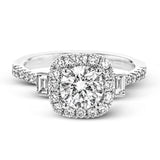 This white gold ring glitters with accents of .41 ctw of round white diamonds and .14 ctw of baguette shaped diamonds for a timelessly elegant look.