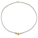 This original 18k two-toned gold necklace features a buckle design that doubles as an innovative clasp.