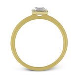 This exquisite, minimalist yellow gold ring features a halo containing .04 ctw of round white diamonds encircling a .16 ctw emerald cut white diamond