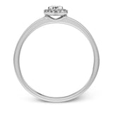 This exquisite, minimalist white gold ring features a halo containing .05 ctw of round white diamonds encircling a .17 ctw oval shaped white diamond