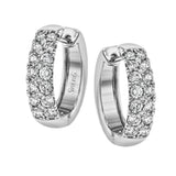 The clean design of these white gold earrings is elevated by 1.05 ctw of sparkling round white diamonds