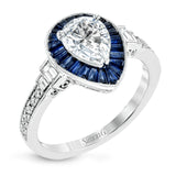 This beautiful pear-shaped setting displays .82 ctw of baguette sapphires in a halo around the center stone. The rest of the ring sparkles with .11 ctw of round diamonds and .17 ctw of baguette diamonds.
