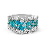 This wonderful fashion ring showcases .62 ctw of bright blue-green paraiba tourmaline in the center, surrounded by 1.91 ctw of white diamonds.