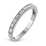 This sleek, minimalist white gold wedding set features a distinctive design with an impressive 1.05 ctw of baguette shaped white diamonds.
