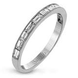 This sleek, minimalist white gold wedding set features a distinctive design with an impressive 1.05 ctw of baguette shaped white diamonds.