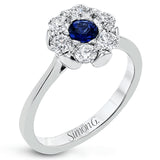 Radiate elegance with this white gold ring's exquisite floral-inspired design, featuring a cluster of .66 ctw of round white diamonds