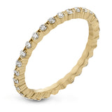 Featuring a modern stackable design, this band yellow gold is accented by .40 ctw round cut white diamonds.