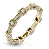 This yellow gold band form a modern style band set with .33 ctw of striking round cut white diamond accents. Perfect for stacking.