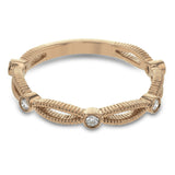These detailed bands in 18k gold can be worn together or paired with other rings. Each one features .11 ctw of shining white diamonds. Perfect for stacking.
