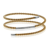 This delicate rose gold bangle hugs the wrist with its understated .42 ctw of white diamond accents in white gold. Perfect for stacking.