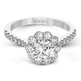 This white gold wedding set frames its centerpiece with .90 ctw of round white diamonds in a whimsical floral-inspired design.