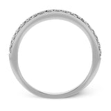 This white gold wedding set frames its centerpiece with .90 ctw of round white diamonds in a whimsical floral-inspired design.