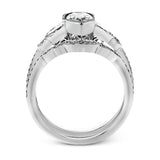 This lovely contemporary design features white gold and .14 ctw of round white diamonds and .42 ctw of oval shaped white diamonds as well as delicate milgrain edging around its centerpiece.