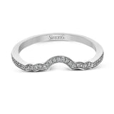 This lovely contemporary design features white gold and .14 ctw of round white diamonds and .42 ctw of oval shaped white diamonds as well as delicate milgrain edging around its centerpiece.