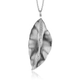 A crisp white gold leaf shimmers with a subtle .16 ctw of white diamond accents in this minimalist, nature-inspired pendant