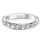 This band pairs perfectly with an engagement ring, or can be worn on its own or stacked with other rings. It contains 1.00 ctw of white diamonds.