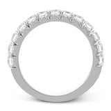 This band pairs perfectly with an engagement ring, or can be worn on its own or stacked with other rings. It contains 1.00 ctw of white diamonds.