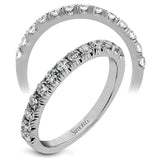 This classic wedding band features a distinctive setting style that shows off the .50 ctw of white diamonds to their full advantage.