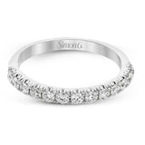 This classic wedding band features a distinctive setting style that shows off the .50 ctw of white diamonds to their full advantage.
