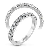 This wedding band has a beautiful timeless design which will be in style for years. The ring contains .77 ctw of white diamonds.