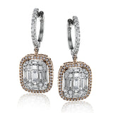 These lovely earrings feature a mosaic of smaller diamonds in the center, creating quite a statement! These 18k white gold earrings contain .41 ctw of round diamonds and .79 ctw of baguette diamonds.