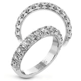 This classic wedding band features a distinctive setting style that shows off the .97 ctw of white diamonds to their full advantage.