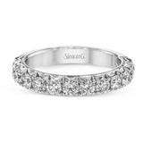 This classic wedding band features a distinctive setting style that shows off the .97 ctw of white diamonds to their full advantage.
