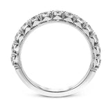 This classic wedding band features a distinctive setting style that shows off the .97 ctw of white diamonds to their full advantage.