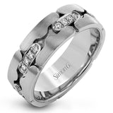 .35 ctw of white diamonds highlight the unique, eye-catching puzzle piece design of this white and rose gold wedding band