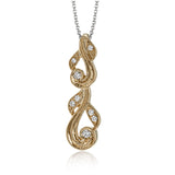 This 18k white gold pendant has a filigree design accented with vintage-inspired milgrain and .17 ctw of white round diamonds.