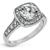 This exquisite white gold ring features a square halo and milgrain detail along with .49 ctw of round white diamond accents.