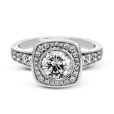 This exquisite white gold ring features a square halo and milgrain detail along with .49 ctw of round white diamond accents.