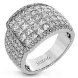 this two-tone 18k gold ring has 2.64 ctw of Simon-set princess cut diamonds along with .44 ctw of round white diamonds. The edge of the overlapping section is accented by .28 ctw of pink diamonds in rose gold.
