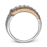 this two-tone 18k gold ring has 2.64 ctw of Simon-set princess cut diamonds along with .44 ctw of round white diamonds. The edge of the overlapping section is accented by .28 ctw of pink diamonds in rose gold.