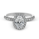 This is a classic halo design wedding set made for an oval center stone contains .72 ctw of white diamonds.