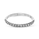 This is a classic halo design wedding set made for an oval center stone contains .72 ctw of white diamonds.