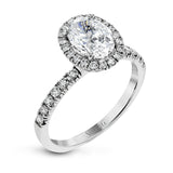 This is a classic halo design wedding set made for an oval center stone contains .72 ctw of white diamonds.