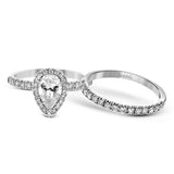 This white gold wedding set is simple yet dazzling with .71 ctw of round white diamonds framing an eye-catching pear shaped centerpiece.