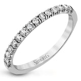 This white gold wedding set is simple yet dazzling with .71 ctw of round white diamonds framing an eye-catching pear shaped centerpiece.