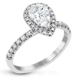 This white gold wedding set is simple yet dazzling with .71 ctw of round white diamonds framing an eye-catching pear shaped centerpiece.