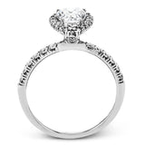 This white gold wedding set is simple yet dazzling with .71 ctw of round white diamonds framing an eye-catching pear shaped centerpiece.