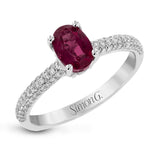 This graceful ring features .31 ctw of white diamonds set into the ring with a .90 ctw ruby.