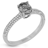 This graceful ring features .31 ctw of white diamonds set into the ring with a .90 ctw ruby.