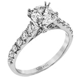 This beautiful white gold engagement ring is set with .55 ctw of round white diamonds flanking the center stone, as well as a distinctive rose gold accent