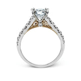 This beautiful white gold engagement ring is set with .55 ctw of round white diamonds flanking the center stone, as well as a distinctive rose gold accent