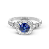 This lovely vintage-inspired setting features a geometric halo design containing .30 ctw of round diamonds, .18 ctw of baguette diamonds, and a center .96 ct sapphire.