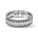 This unique white gold wedding band features .49 ctw of round white diamonds as well as a distinctive edging of coiled rose gold