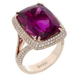 This gorgeous 18k gold cocktail ring features 1.04 ctw of white diamonds and is set with a beautiful 11.71 ct center rubellite. This ring comes in several versions, each with its own unique center gemstone.