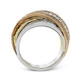 This exquisite ring is crafted in three tones of 18k gold and features an overlapping design set with .41 ctw of round diamonds and 2.32 ctw of baguette diamonds.